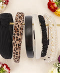 Snag These 7 Pack Of Ultra Comfy Headbands For Women Mixing Neutral Solid Knotted Padded Styles With Pearl Accents Soft Durable Daily Wear Essentials To Upgrade Any Fit displayed on a wooden holder.
