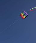 Rainbow Stripes 5.0 Parafoil Kite For All Ages - Frameless Single-Line Travel Kite flying against clear blue sky