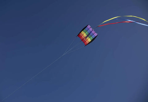 Rainbow Stripes 5.0 Parafoil Kite For All Ages - Frameless Single-Line Travel Kite flying against clear blue sky