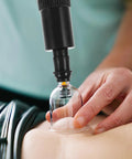 Universal Replacement Manual Cupping Pump with Ergonomic Grip in use on skin with clear vacuum cup attachment