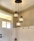 Three Light Farmhouse Pendant Light With Adjustable Ceiling Hanging Fixture And K9 Crystals In Black Finish in hallway