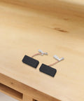 Rock Solid Carbon Brush Set with Wired Springs to Restore Power and Smooth Operation in DWP611 and PK450PK Tools on wooden surface.