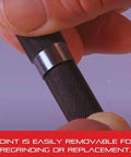 Replacement Point For 18A Automatic Center Punch With Adjustable Stroke, all steel, shown being removed by hand for regrinding.