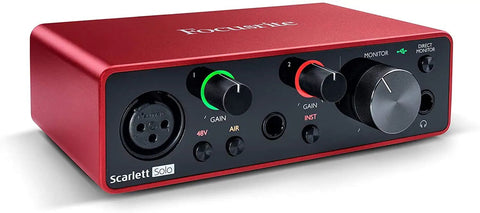 Scarlett Solo 3rd Gen USB Audio Interface in red with control knobs and input ports for home studio recording setup.