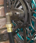 Close-up of a decorative brown hose connection in the NeverLeak Decorative Wall Mount Hose Reel in brown for outdoor yards