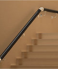 Solid As A Rock Black PVC Railing Kit with Non Slip Banister mounted on stairs, providing secure handrails for safety.
