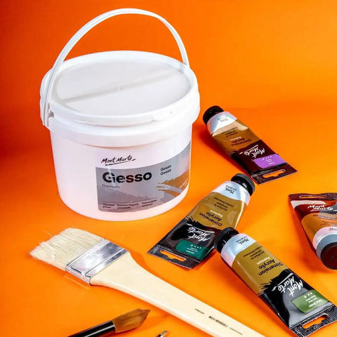 Premium Gesso Universal Primer 64oz for canvas, wood, paper and more with paint tubes and brushes on orange background