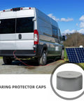 Trailer Wheel Bearing Dust Caps Rubber Covers 1.98 Inch Reusable Replaceable Black Plugs For Hub Protection next to a van and solar panel.