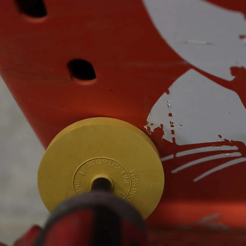 Rubber Eraser Wheel with 4 Inch Pad and Adapter removing vinyl decal from a car surface in auto detailing