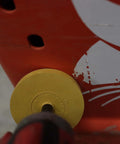 Close-up of Rubber Eraser Wheel 4 Inch Pad And Adapter Set, 6 Pack removing decal from red surface on car or truck.