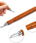 Close-up of a wood carving knife from the Wood Carving Knife Set 20 Piece Kit With Carbon Steel Blades And Electrolytic Coating.