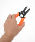 Tough As Nails Wire Stripper Pliers With Cushioned Safety Lock And Stainless Steel Blades held in hand for stripping insulation.