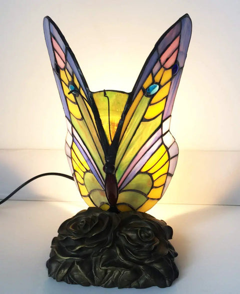 Tiffany Style Butterfly Table Lamp With Stained Glass Multicolor Night Light Blue Glass Accent For Living Room Or Bedroom, Eye Catching Home Decor And Gift Ready Lamp For Kids Or Friends, showing a lit stained glass butterfly on ornate base