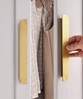 Hand using Brushed Gold Cabinet Pulls 9.75 Inch Polygon Drawer Handles 2 Pack With Screws on a white cabinet door