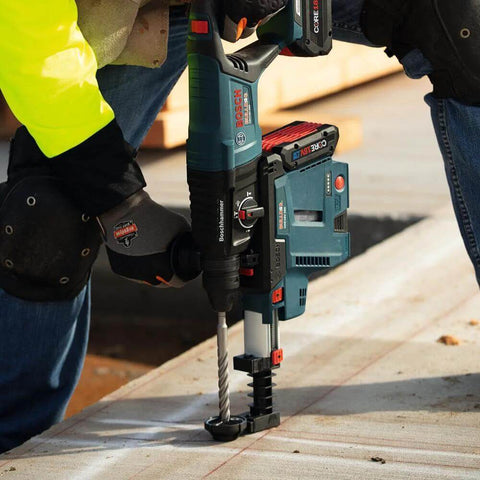 Bosch HC4C2083 1/2 in x 8 in SDS-Plus Bulldog bit installed in blue rotary hammer drilling into concrete