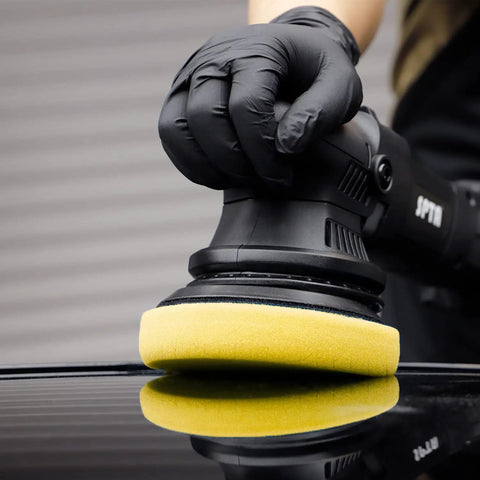 Heavy Cut Swirl Buster T80 Yellow Foam Polishing Pad used on a car surface with a 6 inch backing plate polisher