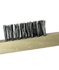 Close-up of beige wood block utility brush with stainless steel bristles for heavy-duty scrubbing on metal and concrete surfaces.