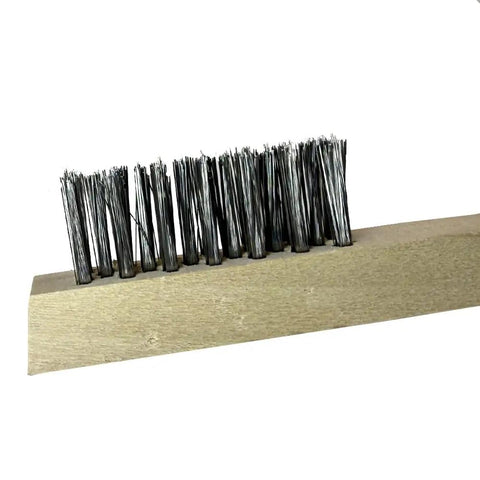 Close-up of beige wood block utility brush with stainless steel bristles for heavy-duty scrubbing on metal and concrete surfaces.