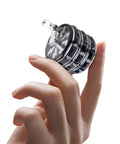 Portable 2.5 Inch Hand Crank Grinder With Clear Top Cover, Large Aluminum Alloy Manual Grinder in hand, foldable handle visible