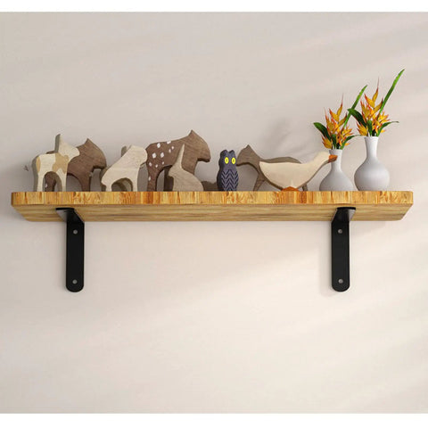 Top Tier Heavy Duty L Shaped Corner Brackets For Shelving Set Of 2 Black Metal Wall Mounts supporting a wooden shelf with decorative items.