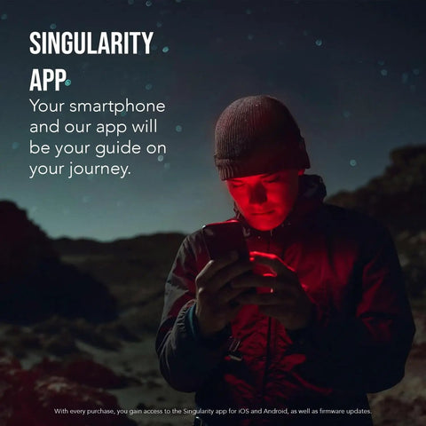 Person in dark landscape using smartphone to control Vespera Pro Smart Telescope With Observation Station under starry sky