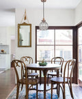 Red Antique Copper Glass Pendant Light hangs over dining table with Cracked Glass Shade, E26 base, 60W max, hardwired, bulb not included.