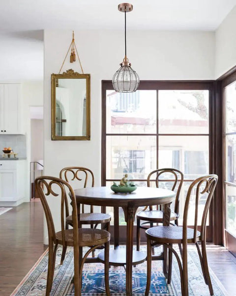 Red Antique Copper Glass Pendant Light hangs over dining table with Cracked Glass Shade, E26 base, 60W max, hardwired, bulb not included.