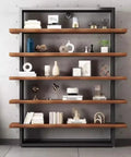 Rock Solid Industrial Bookshelf With Thick Solid Wood Shelves Five Tier Floor Standing Unit For Living Room Or Office Heavy Duty Metal Frame Storage Rack with decorative items.