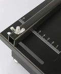 Close-up of the angled pusher with measurement scale on the Rock Solid 24V Micro Table Saw for precise cuts.