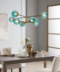 Dining room view of Blue Glass Globe Sputnik Chandelier 8 Light Modern Pendant Fixture For Dining Room Living Room Island Kitchen And Bedroom With Mid Century Vibe And Metal Frame