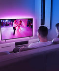 Couple watching TV with Led TV Backlight Kit Plug And Play With USB Power 6.56Ft RGB Color Changing Lights Dope Remote Control