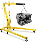 Front view of yellow 2-ton hydraulic engine hoist with six steel casters lifting a car engine