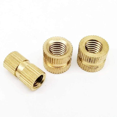 Kick Up Your Tool Game With 25pcs Solid Brass Metric Thread Insert Nuts M2 To M10 Durable Nutserts, showing three brass nutserts.