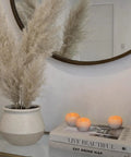 Small Real Wax Flameless Candles with Silver Glitter, 3 pack with LED flicker on tabletop next to books, perfect for home decor