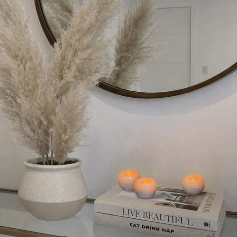Small Real Wax Flameless Candles with Silver Glitter, 3 pack with LED flicker on tabletop next to books, perfect for home decor