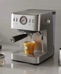 Compact Espresso Machine With 20 Bar Pressure And Digital Temp Display Built In Milk Frother brewing coffee into a yellow mug.
