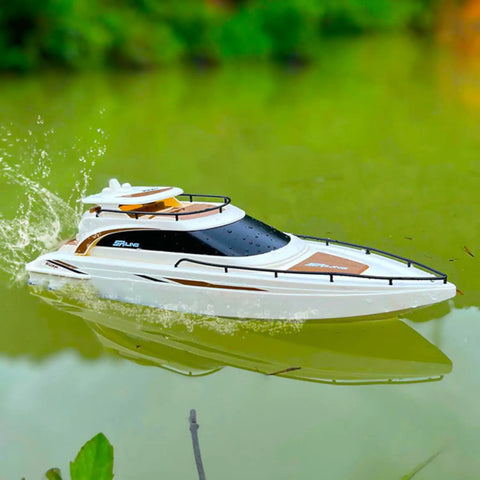 Dope Modern Yacht RC Boat One To Twenty Eight Scale with 2.4GHz Remote cruising on a pond with glossy ABS hull visible