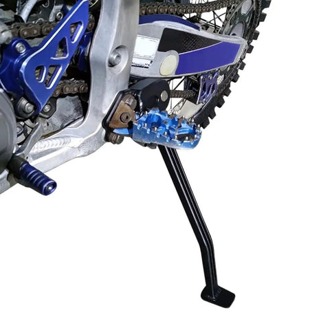 Image of a lightweight aluminum motorcycle kickstand installed on a Yamaha YZ250F YZ450F dirt bike from 2006 to 2009, side view. Lightweight Aluminum Motorcycle Kickstand For YZ250F YZ450F 2006 2009 Dirt Bike Side Stand With Anodized Rust Resistant Finish No Fuss Install For Stable Parking And Long Lasting Durability.