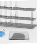 Hands On Magnetic Field Demonstration Kit With Iron Filings For Science Experiments And Classroom Education Perfect For Physics Labs STEM Learning And Magnetic Field Visualization For Students with iron filings in a clear case next to test tubes and petri dish.
