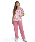 Woman wearing hot pink scrubs tops and pants set for women perfect for nurses veterinary techs dental hygienists and pet groomers