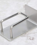 Rock Solid Stainless Steel Bathroom Hook With Tight Suction Mount For Hanging Towels And Scrub Brushes Heavy Duty Wall Organizer No Fuss Setup Dependable Grip For Daily Household Use on a marble surface.