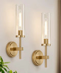 Modern Brushed Gold Wall Sconces Set Of Two With Clear Glass Hardwired Adjustable Up Or Down Vanity Light Fixture For Bathroom Smooth Vibe Upgrade on a wall.