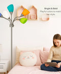 Medusa Adjustable Floor Lamp for Bedroom With Five Multi Colored Acrylic Shades Gooseneck Standing Reading Lamp Modern Metal Floor Light in Silver Finish in cozy bedroom setting.
