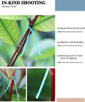 Top Shelf Flat Iron Wire Twist Ties For Garden Vine Support And Plant Securing Reusable Red Gardening Strips With Sturdy Metal Core Super Tough And No Fuss Around Shrubs Roses And Climbers, close-up of tie securing plant stem.