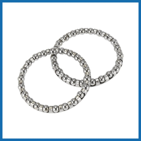 Close-up of two bicycle ball bearing retainers, each with 22 balls, 40mm outer diameter for Four Piece Bicycle Ball Bearing Retainer Set With 22 Balls 40mm Outer Diameter And 33.5mm Inner Diameter Replacement Crank And Wheel Bearings For Bike Maintenance And Upgrades.