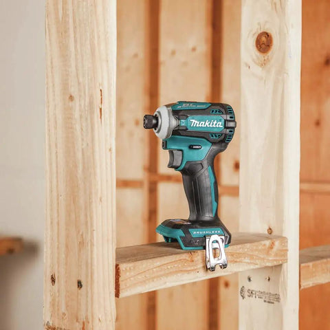 XDT16Z 18V LXT Brushless Cordless Impact Driver with Quick Shift Mode on wooden frame, showcasing compact design.