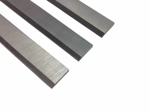 Pro Shop Six One Eighth Inch Jointer Blade Replacement Set Of 3 Cuts Through Hardwoods Like Warm Butter High Carbon Steel Planer Knives close-up view of three steel blades