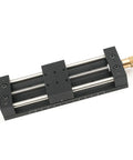 Built Tough Aluminum Manual Sliding Table Actuator showing precise linear motion mechanism with black coated frame and threaded feet.