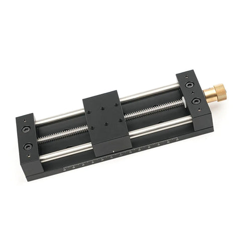 Built Tough Aluminum Manual Sliding Table Actuator showing precise linear motion mechanism with black coated frame and threaded feet.