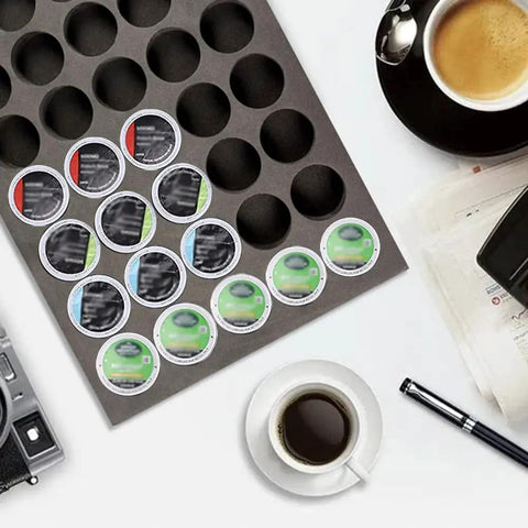 Neat 40 Pod Coffee Pod Organizer Drawer Tray for K Cup Keurig Pods on counter with coffee cup and newspapers